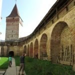 Saxon village with fortified church tower and walls mosna